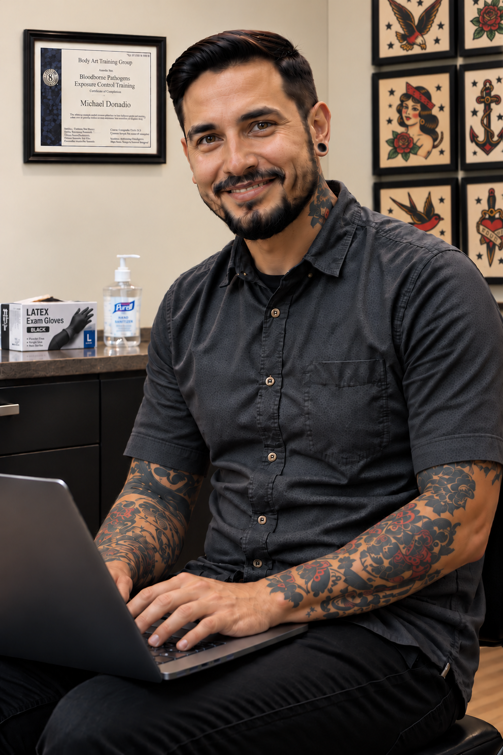 Smiling tattoo artist in his studio.